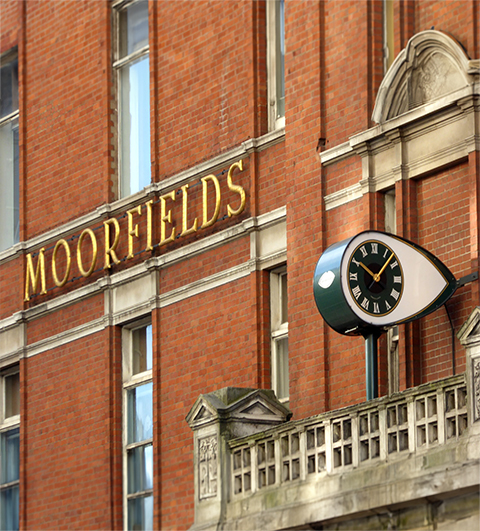the exterior of Moorfields Private Eye hospital with the sigh and eye-shaped clock